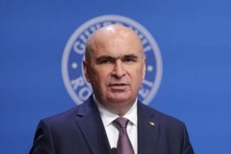 bolojan-aurajpg - Știri de azi Știri de azi | Ilie Bolojan explică de ce mamele aflate în perioada de creştere a copilului şi pensionarii cu pensii mai mari de 3.000 de lei trebuie să achite contribuţii la sănătate: Nu mai putem fi o ţară de excepţii, pentru că nu ne mai putem permite - Știri de azi |